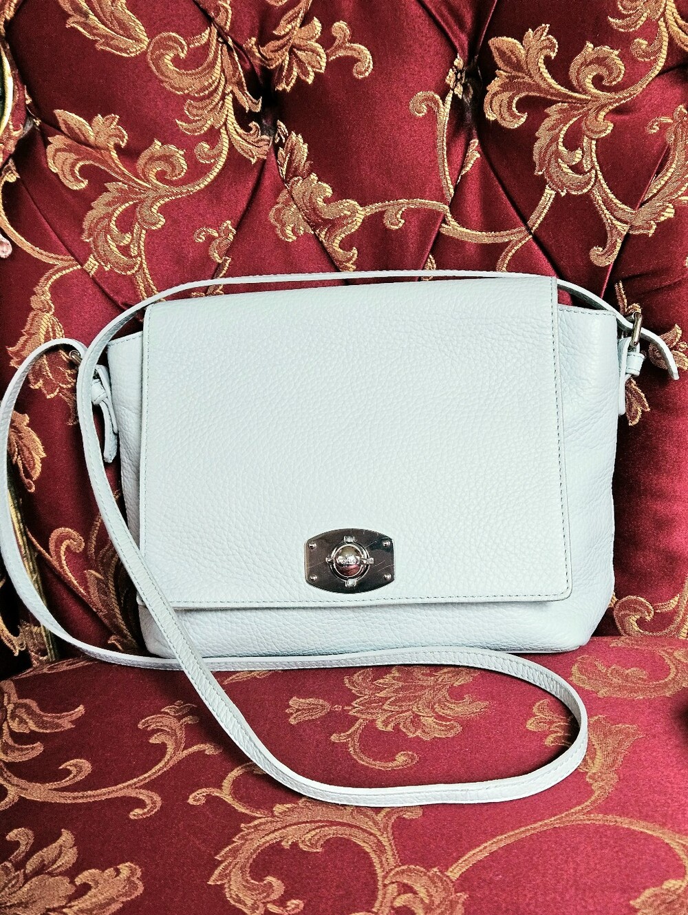 Furla Appaloosa Pebbled Leather Crossbody Bag in a light ice-blue color.